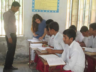 Migena with students at Dalgram BL High School